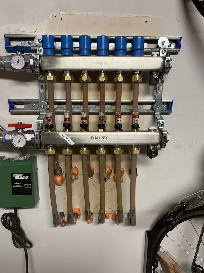 Plumber performing Water Heater Repair at a residential property in Larksville